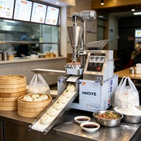 Machine automatique commerciale pour la fabrication de momos 220V 3000 pièces/h en acier inoxydable, formatrice de raviolis