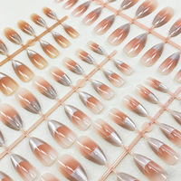 Faux ongles à presser en ABS, courts, effet dégradé rose blush, motif œil de chat coucher de soleil, pré-dessinés, pour un teint éclatant et une allure purement séduisante