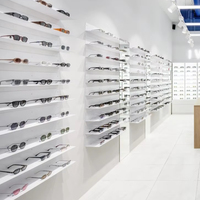 Étagère d'affichage optique LED en MDF personnalisée, élégante et luxueuse, avec un design écologique pour la décoration intérieure des magasins de lunettes