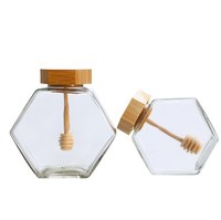 Tarro de miel al por mayor de cristal con forma hexagonal, recipiente para miel con cucharón de madera y tapa de corcho, almacenamiento de miel y jarabe en forma de colmena