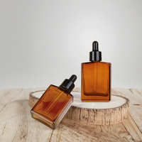 Flacon compte-gouttes rectangulaire en verre ambré 30ml 50ml 100ml pour huiles essentielles, sérums de soin et gouttes pour les yeux, avec impression de logo personnalisée