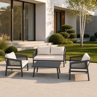Ensemble de meubles de patio extérieur gris anthracite 4 pièces : causeuse, 2 fauteuils, table basse rectangulaire, structure métallique pour jardin et cour arrière