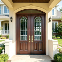Porte d'entrée double cintrée de luxe avec dessus arrondi et inserts en verre sur mesure pour l'architecture de villas modernes haut de gamme