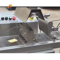Machine d'enrobage de chocolat FXN en promotion – Machine de traitement du cacao pour ligne d'enrobage de barres chocolatées et usage en pâtisserie
