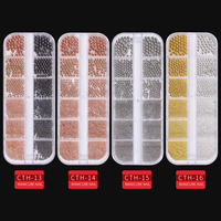 Nouveaux accessoires pour ongles transfrontaliers petites perles en acier dans une boîte longue à 12 grilles ensemble de clous en métal doré et argenté