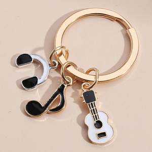 Porte-clés piano musical Porte-clés en émail Porte-clés mignon Instrument Violon Notes Clavier Casque Porte-clés musique - Product Image 6