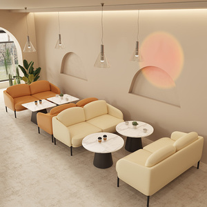 Elegante juego de muebles de café con sofás color naranja crema y mesas superiores de mármol para interiores de salón modernos - Product Image 1