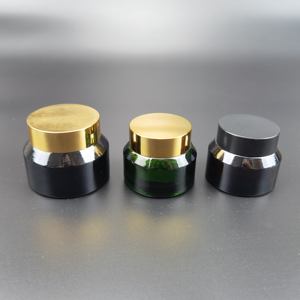 Tarro de vidrio redondo de 50g/100g transparente/negro/verde/azul con hombro inclinado y tapa de plástico dorada/negra - Product Image 4