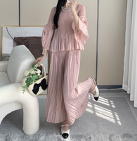 Vente en gros OEM ensemble deux pièces pour femmes musulmanes modestes vêtements de détente décontractés plissés pantalons à jambes larges ensemble de cardigans solides pour le Ramadan