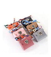 Nouveau mini sac à main porte-monnaie porte-clés en cuir avec cordon noué et breloque, disponible en différentes couleurs