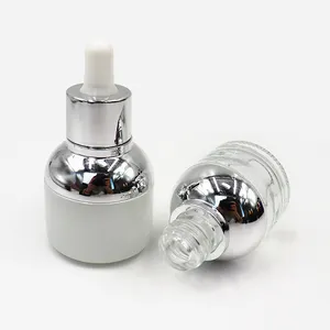 Botellas cuentagotas de vidrio de aceite de cara vacía con cuello plateado dorado 20ml 30ml botella cuentagotas de bombilla blanca de suero redondo