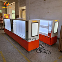 Kiosque à lunettes de soleil au design unique et personnalisé avec tiroirs, vitrine de magasin d'optique orange et blanche pour la vente au détail