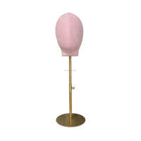 Tête de mannequin femme en fibre de verre rose de luxe avec pose debout pour la présentation visuelle en magasin