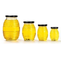 Vente en gros de bouteilles de miel vides de 100g 250g 500g 1000g pots de miel en verre transparent en nid d'abeille avec couvercle en métal