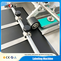 Machine d'étiquetage automatique de bureau pour surfaces planes, boîtes plates, cartes, sacs, livres, bouteilles, autocollants adhésifs