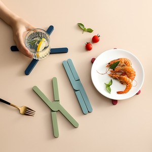 Support de casserole en silicone personnalisé résistant à la chaleur, réutilisable, en forme de X, pour casseroles et poêles chaudes - Product Image 1