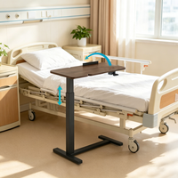 Table de lit roulante pneumatique en métal pour mobilier hospitalier avec plateau inclinable, design moderne pour usage patientiel dans les écoles et les chambres
