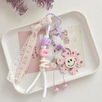 Porte-clés personnalisé motif fleur souriante, breloque de sac avec perle lettre SUN, pendentif à ruban de dentelle et pompon, accessoires Kawaii en gros