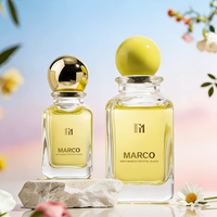 Vente en gros de flacons de parfum en verre cylindriques de 50 ml et 100 ml avec pompe pulvérisatrice et bouchon en forme de boule