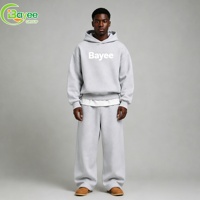 Ensemble de survêtement décontracté pour homme, style streetwear, comprenant un sweat à capuche court coupe ample gris chiné et un pantalon de survêtement large assorti, marque privée