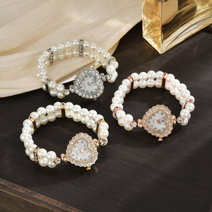 Stylish <b>watch</b> featuring a heart-shaped dial fully set with rhinestones and pearls, a petite strap, and a beautiful double-row pe - Product Image 5