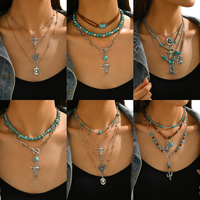 Collier ethnique style bohème western cowboy européen-américain avec perles noires incrustées en forme de riz AaaA et tête de taureau cactus