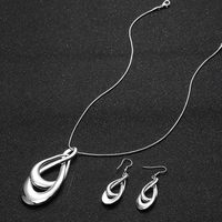 Parure de bijoux plaqué argent pour femme : Collier long tendance avec pendentif et boucles d'oreilles pendantes à chaîne serpent – Vente en gros personnalisée