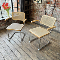 Fauteuil rembourré en PU bois de rotin naturel design vente en gros chaise de salle à manger pieds chromés chaise en porte-à-faux avec osier