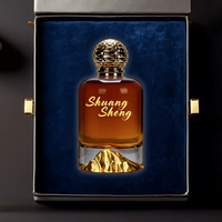 Flacon de parfum de luxe en verre transparent de 100 ml avec base en forme de montagne dorée et bouchon texturé pour emballage de marque