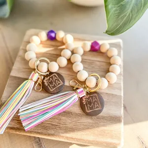 Personal isierte benutzer definierte geschnitzte leere Scheibe Log Farbe Holz Perle Farbe PU Quaste Wrist let Schlüssel bund für Frauen Geschenk