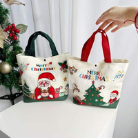 Articles cadeaux de Noël en toile réutilisables en gros avec personnalisation de logo par lots. Sac fourre-tout tendance pour les fêtes