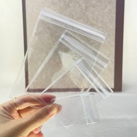 Sac à bijoux en PVC transparent avec logo personnalisé, imperméable, 100 pièces MOQ, réutilisable, à fermeture éclair, en plastique pour l'emballage de bagues, de boucles d'oreilles, de lunettes