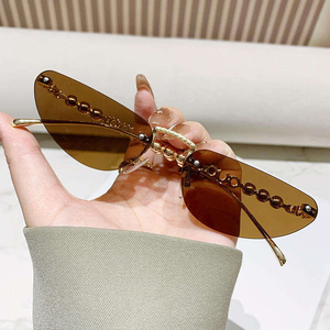 Lunettes de soleil pour femmes, style streetwear, nouvelle collection, lunettes de soleil œil de chat en métal avec incrustations de perles, protection UV - Product Image 1