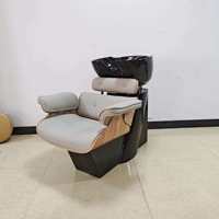 Fauteuil de lavage inclinable de luxe en cuir PU noir avec structure en fibre de verre céramique, design minimaliste moderne pour salon de coiffure professionnel