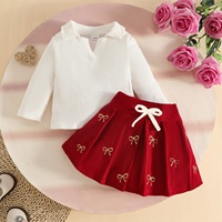 Nouvel ensemble décontracté de Noël automne pour bébé fille : pull tricoté à manches longues et jupe plissée à nœuds (2 pièces) – Vente en gros