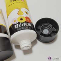 LIXIN/OEM LX10090 Guangdong de qualité alimentaire PCR plastique cosmétique fleur de montagne sauvage Honeytube avec différents couvercles de tubes