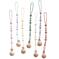 Attache-sucette en silicone pour bébé avec hochet et clip en bois anti-perte pour apaiser le nourrisson et prévenir les chutes