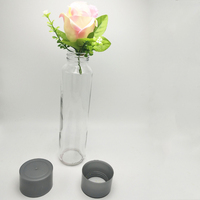 Bouteille d'eau en verre Voss cylindrique à parois droites en gros avec bouchon pour eau minérale