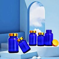 Vente en gros de 75ml 100ml 120ml 150ml 200ml 250ml 300ml 400ml 500ml Capsule pharmaceutique en verre bleu avec bouchon à vis
