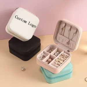 Mini boîte à bijoux de voyage en cuir avec logo personnalisé boîte à bijoux de voyage portable pour femmes ornements boucle d'oreille étui à bijoux stockage de matériaux en cuir PU velours