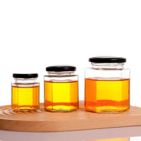 Botol Penyimpanan Madu Selai Kaca Transparan Bentuk Heksagonal Food Grade 100ml 180ml 280ml 380ml 500ml yang Dapat Didaur Ulang dengan Tutup Logam