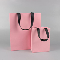 Sac en papier promotionnel personnalisé avec estampage doré texturé et poignées en corde pour diffuseur de parfum, sérum, lotion pour la peau, ornement