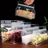 Vente en gros Sacs alimentaires PE à fermeture éclair Emballage de pochette debout en plastique transparent givré avec poignée de magasinage et fermeture éclair