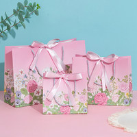 Nouveau sac en papier de luxe rose personnalisé avec logo, sacs cadeaux promotionnels en carton avec poignées en ruban