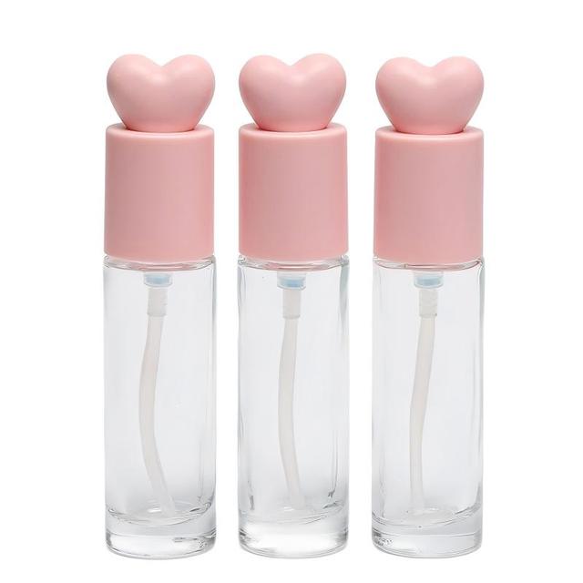Luxury 30ml Refillable Glass Liquid Serum Foundation Bottle with Pink Heart Cap and Press Mechanism for Cosmetic Packaging