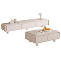 Ensemble de meubles TV minimalistes style Japandi, finition crème chaud, coins arrondis, avec table basse assortie, pour salon.