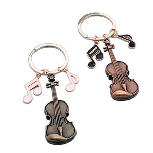 Llavero con nota musical de violín vintage, colgante para mochila, joyería de moda europea y americana, regalo creativo - Product Image 1