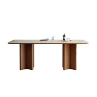 Table à manger au design moderne avec plateau rectangulaire en pierre frittée et base unique pour salle à manger