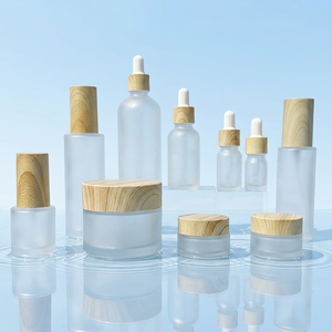Luxury 2 oz 4oz Boston Round Clear Glass Facial <b>Oil</b> <b>Bottle</b> with Bamboo Collar Premium Beauty Packaging - Product Image 1