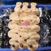 Vente en gros 613 faisceaux de cheveux humains vierges 10a tissages de cheveux humains brésiliens extensions de vague de corps faisceaux de cheveux blonds